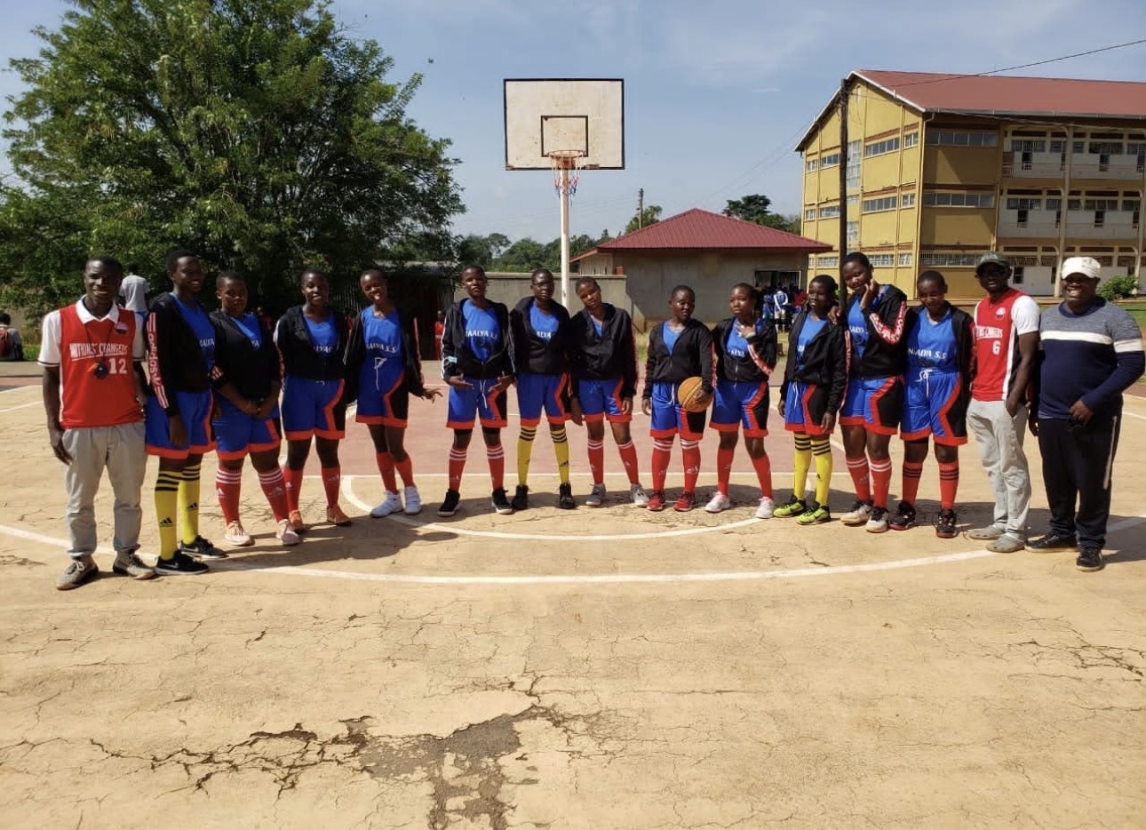 Nations' Changers girls' basketball team lined up with coaches