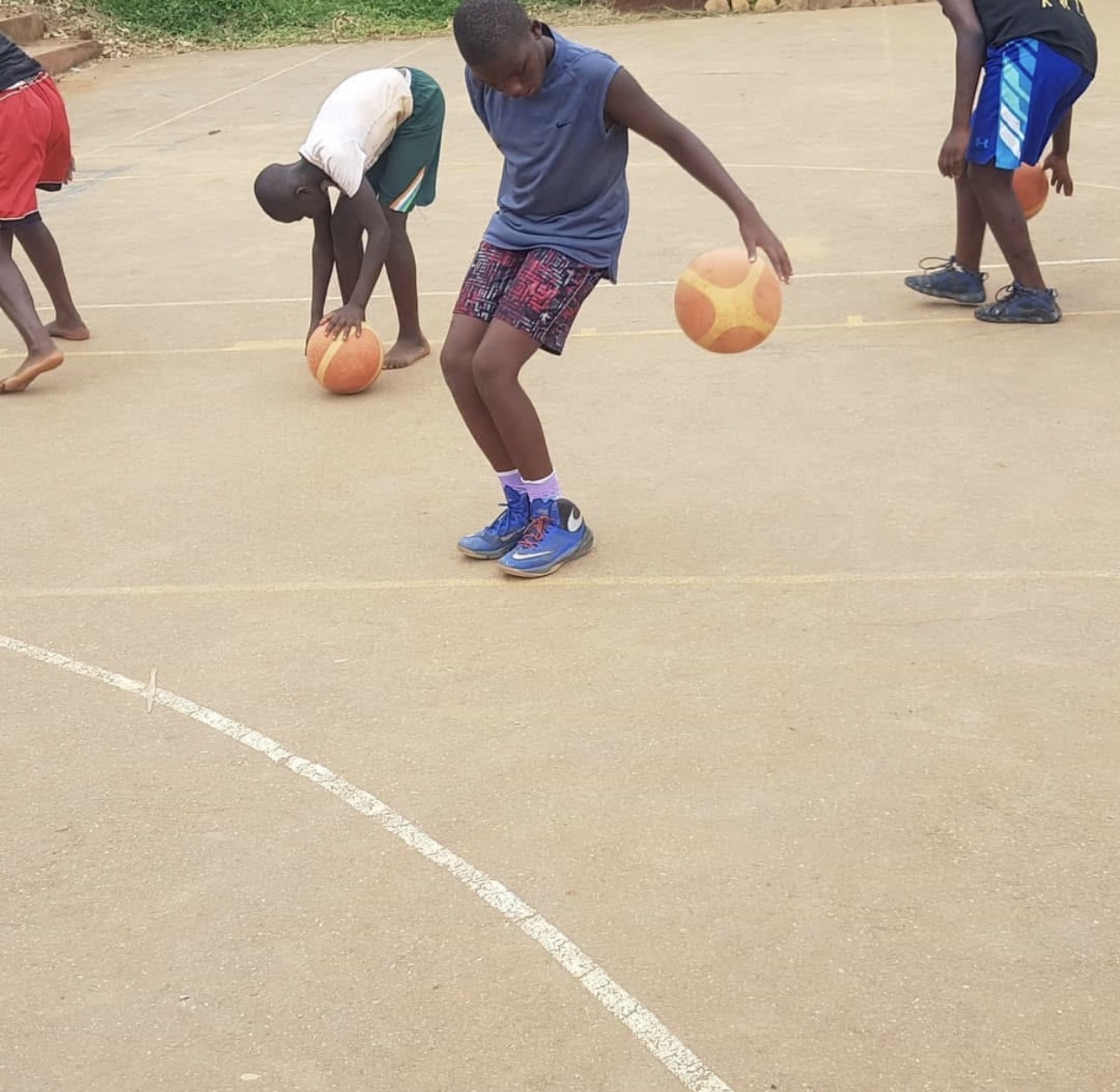 Boy working on ball-handling in athletic gear