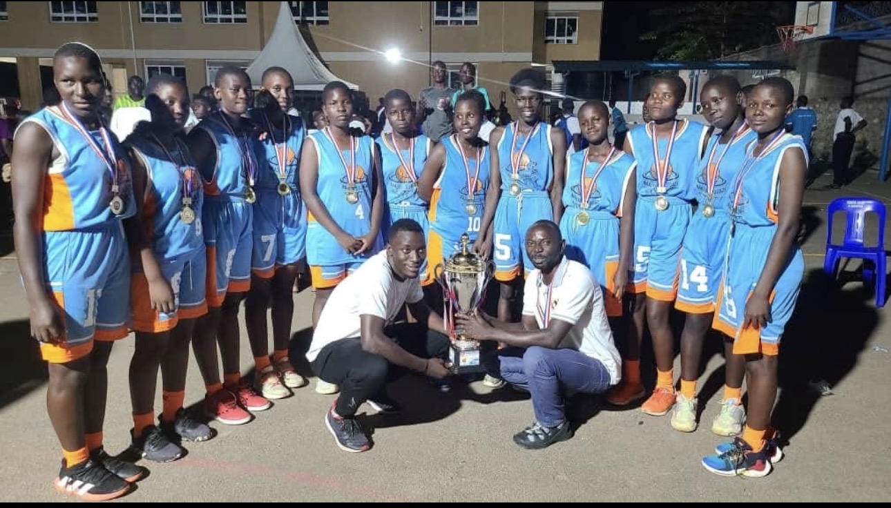 Championship girls' basketball team with trophy and medals