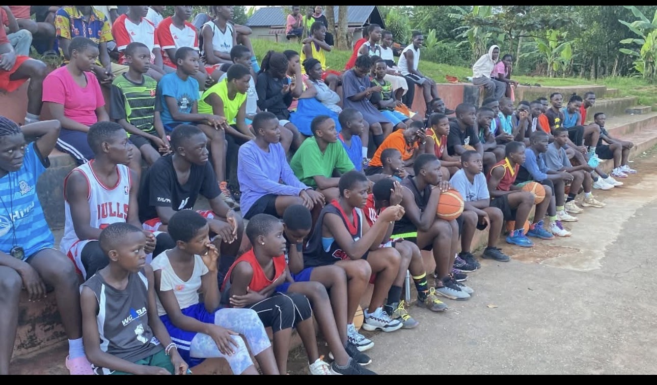Young players gathered courtside at a tournament