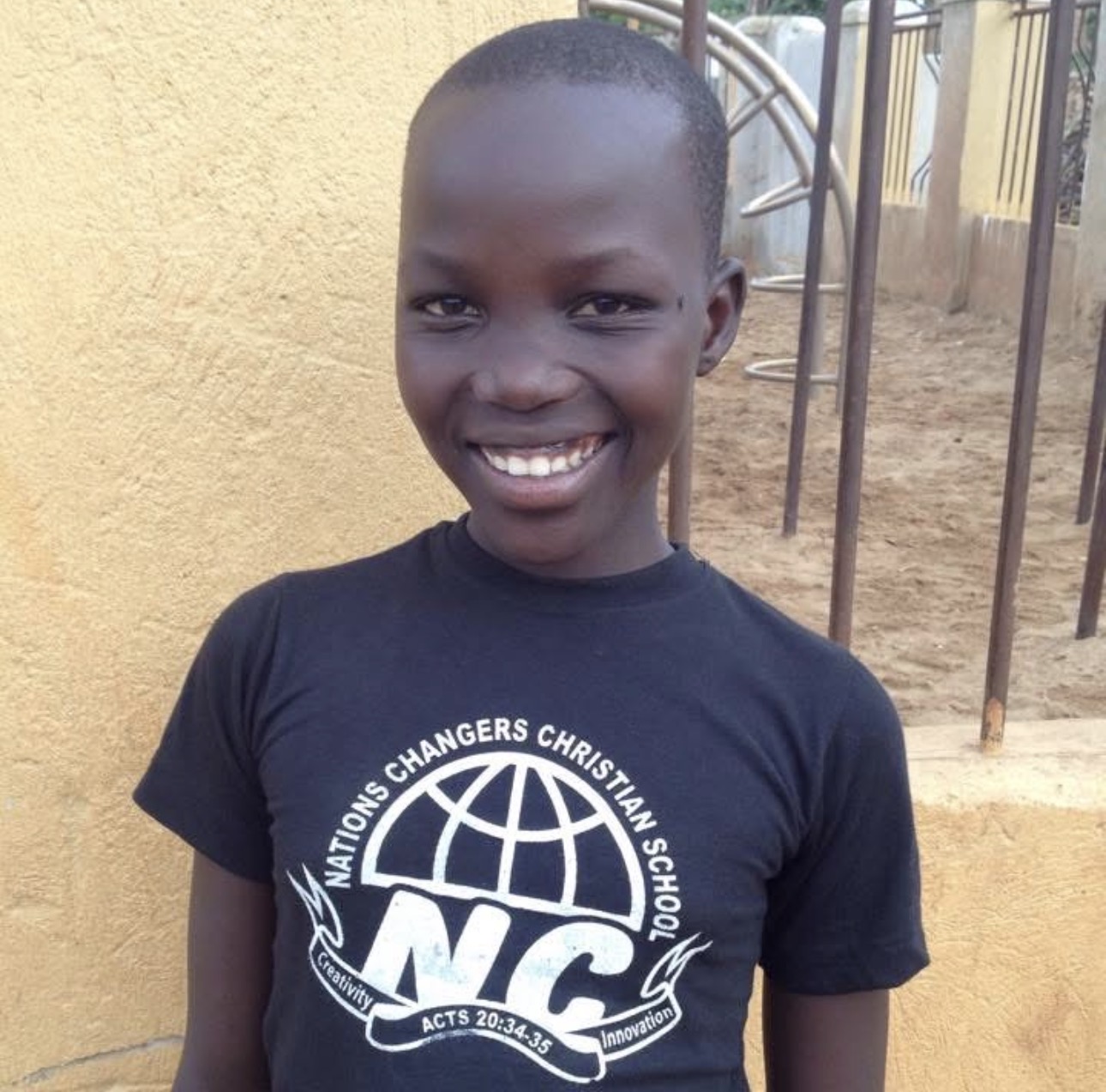 Student wearing a Nations Changers Christian School t-shirt